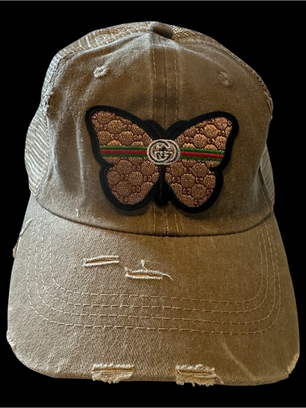 Distressed khaki trucker hat with butterfly